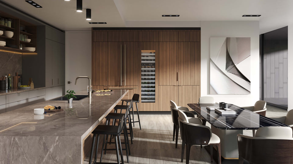 Open-concept kitchen and dining area with stone island and wood cabinetry.