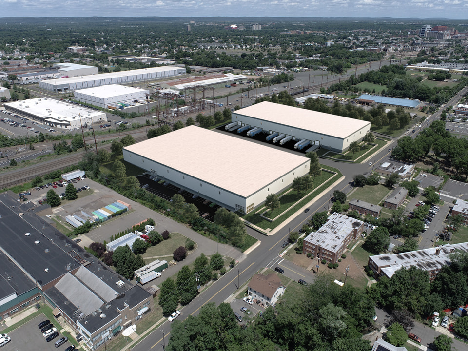 Flex industrial building exterior rendering with mixed office frontage and grade-level warehouse loading