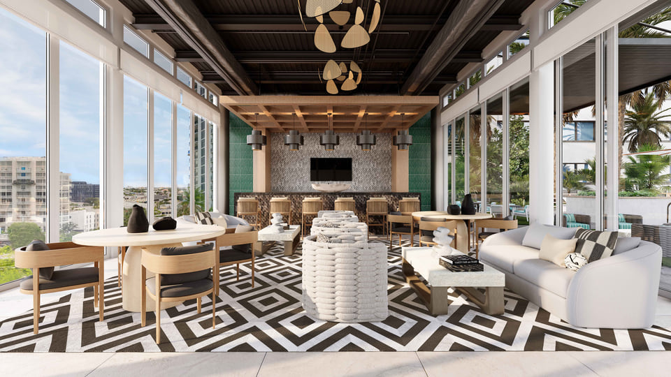 Rooftop bar and lounge with chevron floor pattern and skyline views.