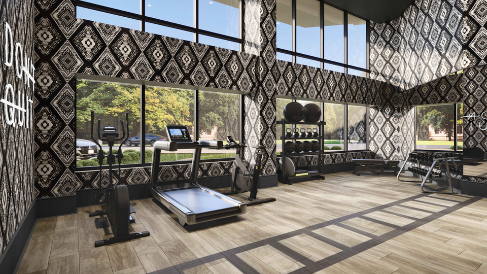 Arlington, VA — multifamily fitness center with cardio equipment, free weights, mirrors, and patterned walls