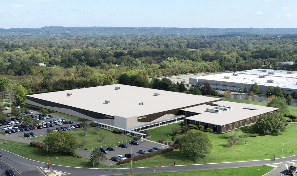 Speculative warehouse exterior rendering with dock-high loading and clerestory glazing at the office block