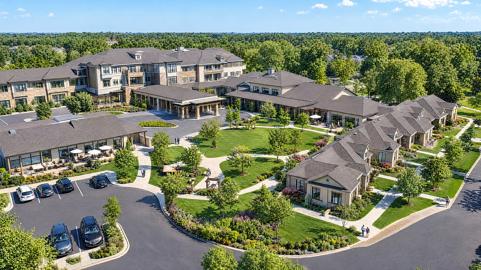 Aerial rendering of a senior living campus with residences, courtyards, and landscaped paths