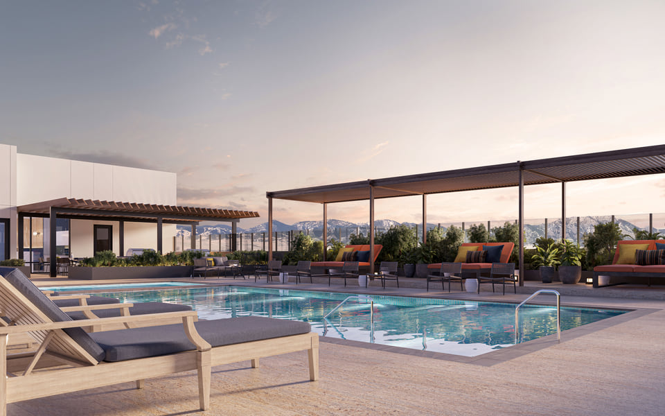 Origin multifamily rooftop pool rendering at dusk with lounge terraces