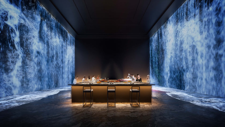 Sports & entertainment suite with bar seating and immersive digital waterfall walls