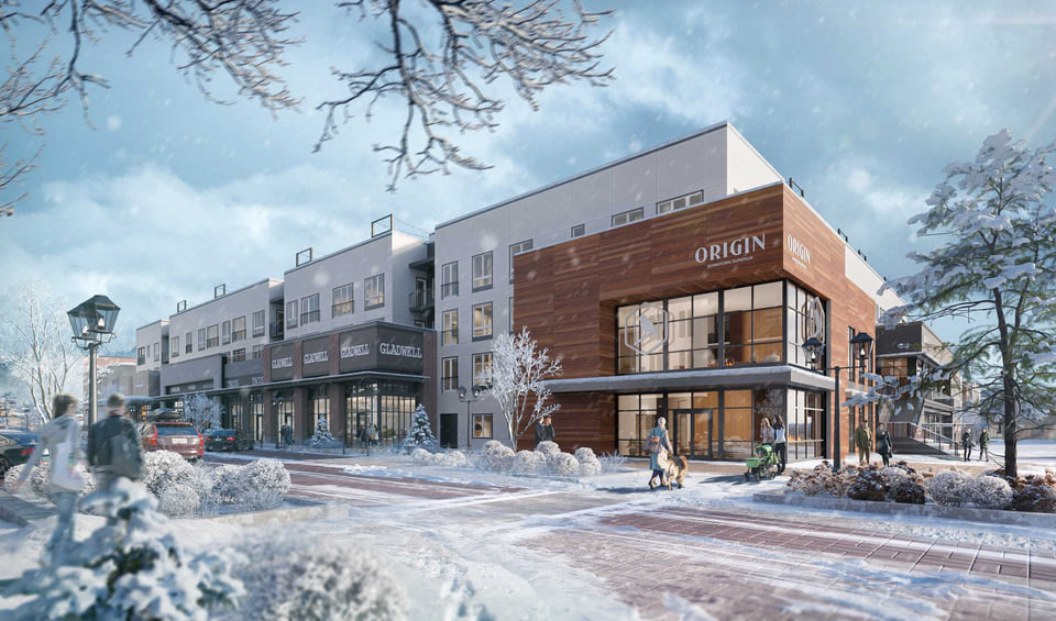 Winter street rendering of the Origin Downtown Superior mixed-use building with a wood-clad corner facade, Gladwell retail bays, and snow falling on pedestrians