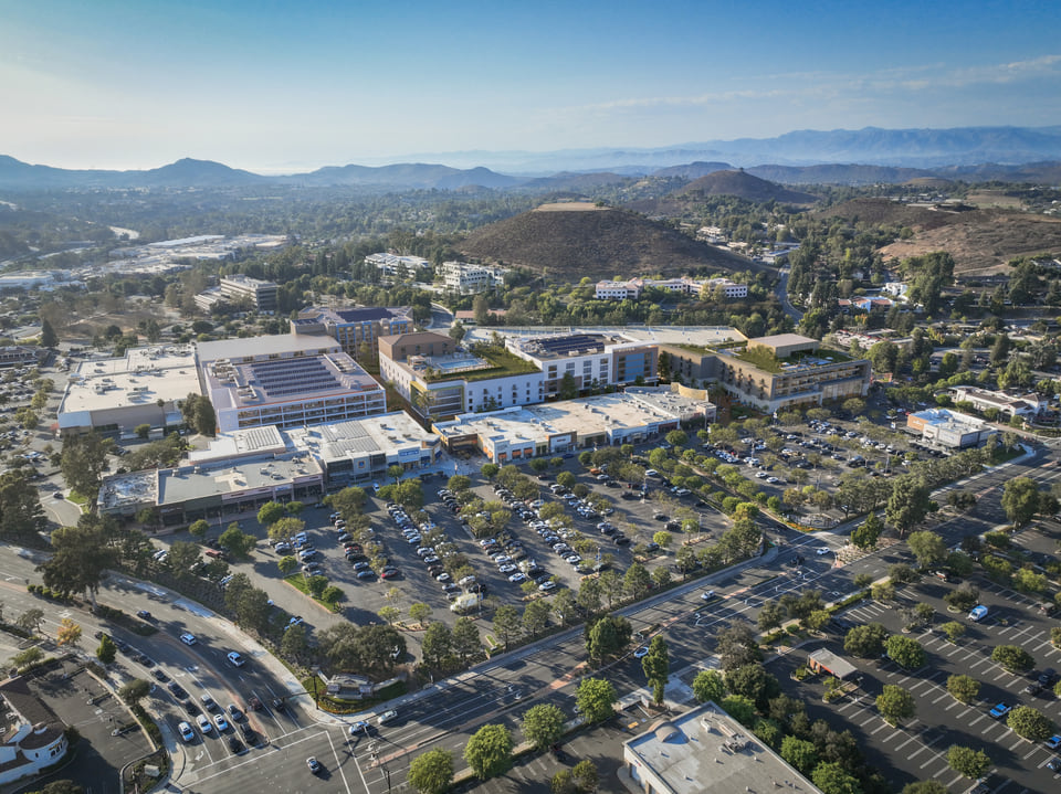 Janss Marketplace, Thousand Oaks CA. Aerial rendering of the repositioned open air retail center with new mixed-use buildings, green roofs, and the Conejo Valley hills beyond by Radical Galaxy Studio