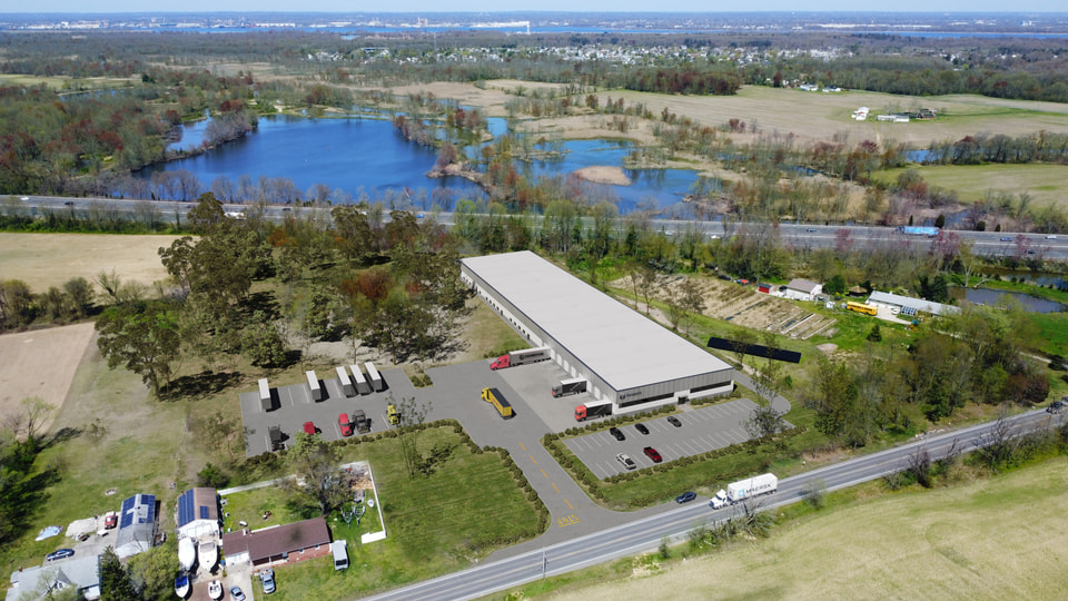 Aerial rendering of a multi-building logistics park with drive-around circulation and independent truck courts