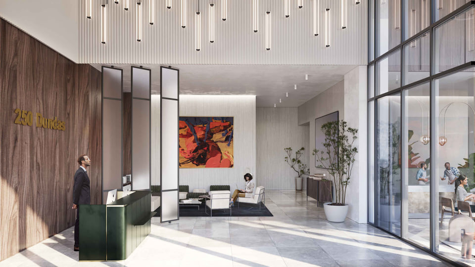 Mixed-use lobby with warm wood paneling and lounge seating.